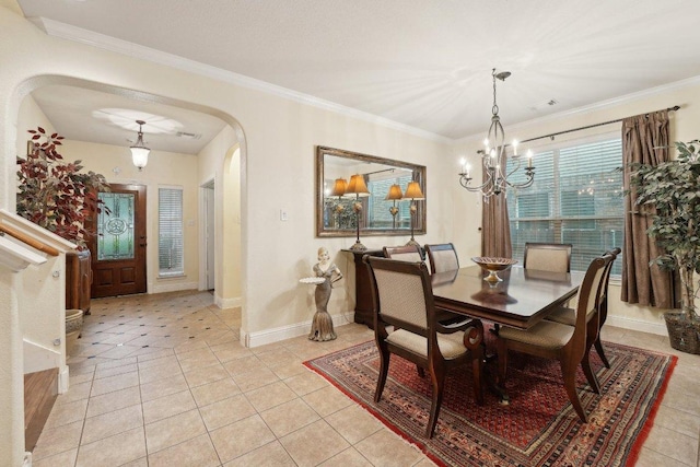 3822 Sky Ln, Round Rock, TX 78681 - dining room featuring arched walkways, a chandelier, light tile patterned flooring, baseboards, and ornamental molding