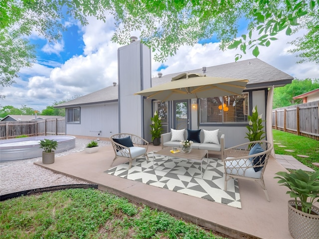 8100 Beaconcrest Dr, Austin, TX 78748 - back of house with a patio area, a fenced backyard, a chimney, and an outdoor hangout area