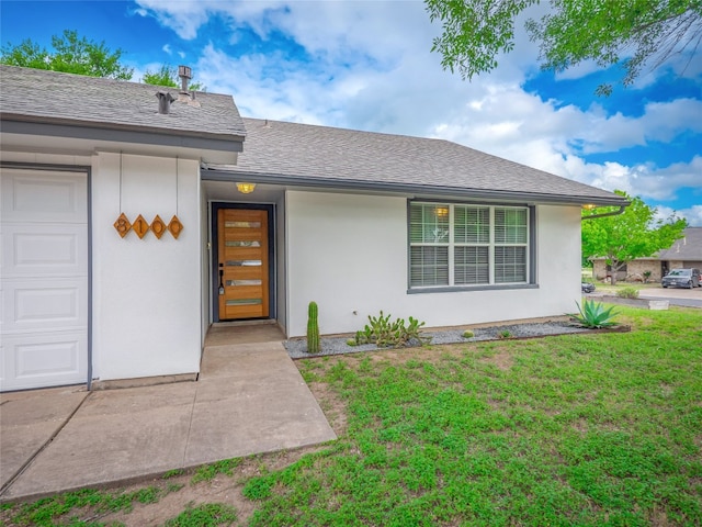 8100 Beaconcrest Dr, Austin, TX 78748 - doorway to property featuring a lawn, a shingled roof, stucco siding, and a garage