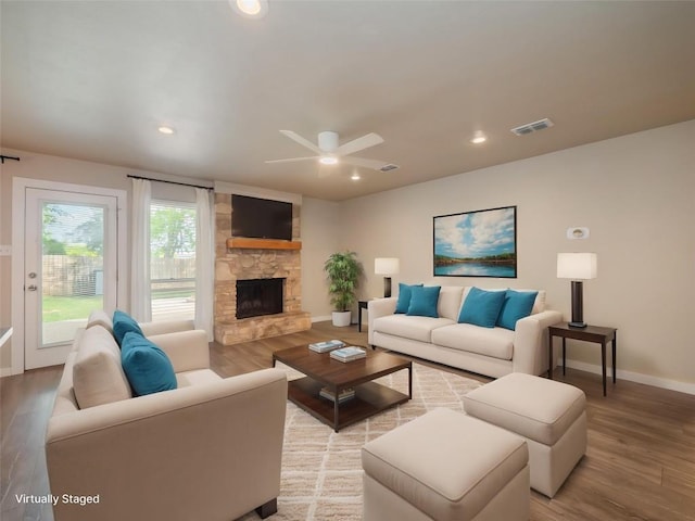 8100 Beaconcrest Dr, Austin, TX 78748 - living area with light wood-type flooring, a ceiling fan, recessed lighting, and a fireplace