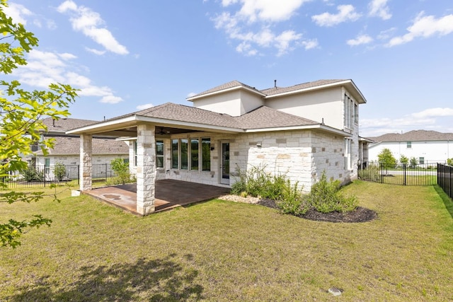 904 Arundel Rd, Lakeway, TX 78738 - rear view of house with a patio area, stone siding, and a fenced backyard