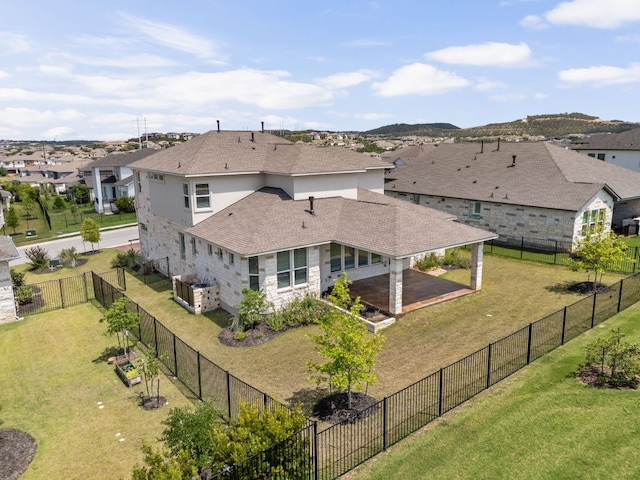 904 Arundel Rd, Lakeway, TX 78738 - back of house featuring a residential view, a shingled roof, a patio area, and a fenced backyard