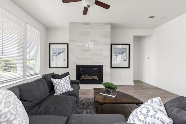 904 Arundel Rd, Lakeway, TX 78738 - living room featuring ceiling fan, wood finished floors, and a fireplace