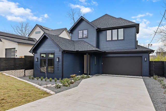 4303 Hank Ave, Austin, TX 78745 - view of front facade featuring an attached garage, a shingled roof, and driveway