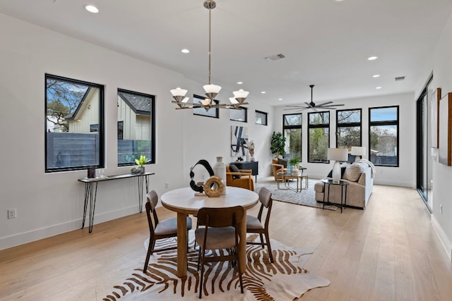 4303 Hank Ave, Austin, TX 78745 - dining area with recessed lighting, light wood-style floors, baseboards, ceiling fan, and a chandelier