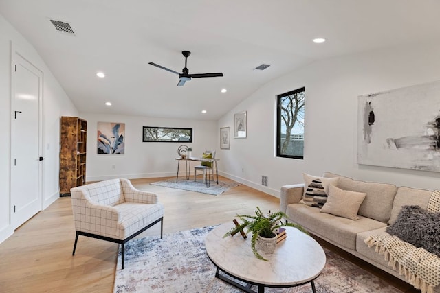 4303 Hank Ave, Austin, TX 78745 - living room featuring ceiling fan, vaulted ceiling, light wood-style floors, recessed lighting, and baseboards