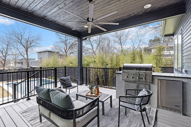 4303 Hank Ave, Austin, TX 78745 - wooden terrace with ceiling fan, exterior kitchen, and an outdoor hangout area