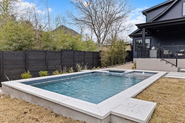 4303 Hank Ave, Austin, TX 78745 - view of pool with a fenced backyard, a pool with connected hot tub, and a mountain view