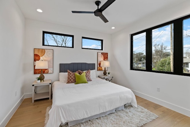 4303 Hank Ave, Austin, TX 78745 - bedroom featuring multiple windows, light wood finished floors, a ceiling fan, and recessed lighting