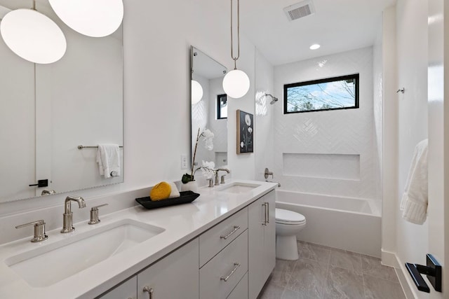 4303 Hank Ave, Austin, TX 78745 - full bath featuring double vanity, shower / bathtub combination, and marble finish flooring