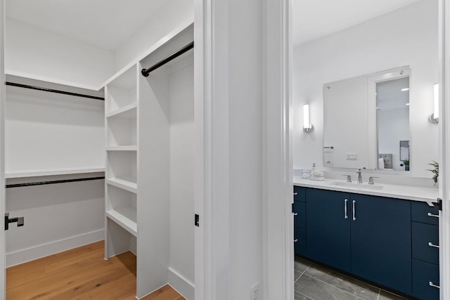 4303 Hank Ave, Austin, TX 78745 - spacious closet featuring a sink and light wood-type flooring