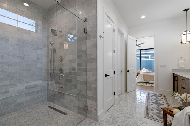 1207 Aggie Ln, Austin, TX 78757 - ensuite bathroom with vanity, a shower stall, and recessed lighting