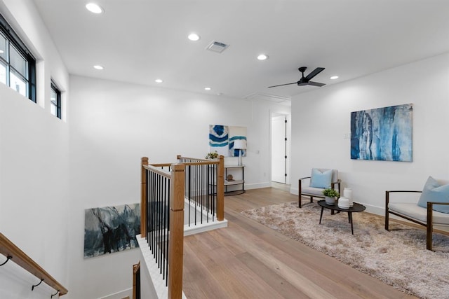 1207 Aggie Ln, Austin, TX 78757 - living area featuring an upstairs landing, recessed lighting, ceiling fan, and wood finished floors