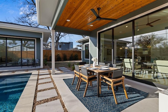 1207 Aggie Ln, Austin, TX 78757 - view of patio with a ceiling fan and outdoor dining area