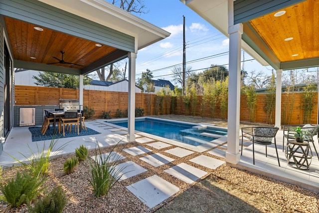 1207 Aggie Ln, Austin, TX 78757 - view of pool featuring a patio area, a fenced backyard, an outdoor fire pit, and grilling area