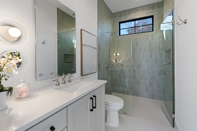 1207 Aggie Ln, Austin, TX 78757 - full bathroom with vanity, a stall shower, and tile patterned floors