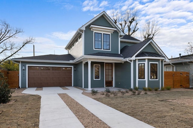 1207 Aggie Ln, Austin, TX 78757 - traditional-style house featuring driveway, covered porch, a garage, and a shingled roof