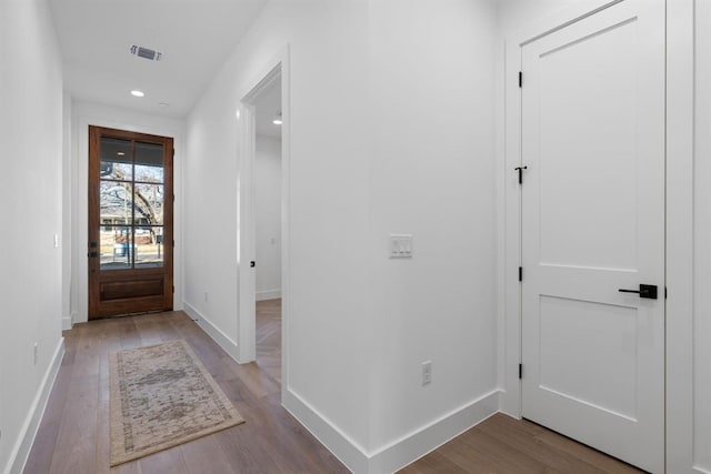 1207 Aggie Ln, Austin, TX 78757 - entryway with wood finished floors and recessed lighting