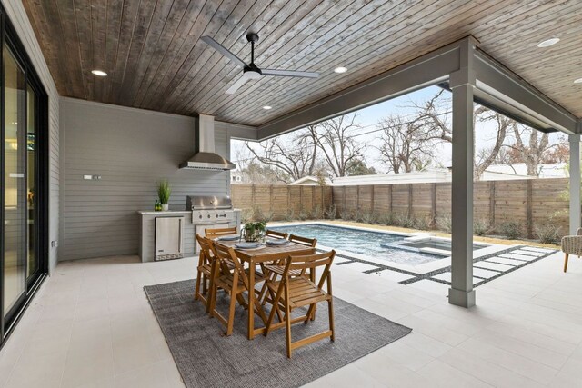 6505 Nasco, Austin, TX 78757 - fenced backyard featuring exterior kitchen, a ceiling fan, a patio, outdoor dining space, and a pool with connected hot tub