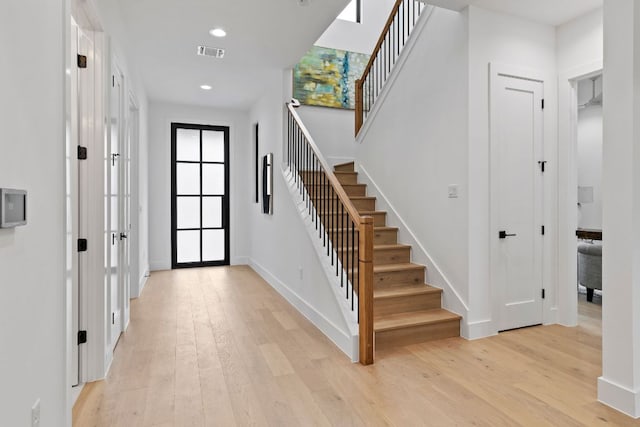 6505 Nasco, Austin, TX 78757 - foyer featuring stairs, light wood-style floors, baseboards, and recessed lighting