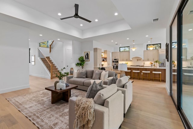 6505 Nasco, Austin, TX 78757 - living room featuring a ceiling fan, light wood finished floors, stairs, recessed lighting, and baseboards