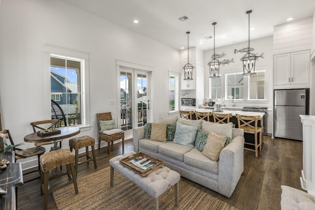 214 Sunset Ave Unit 5, Port Aransas, TX 78373 - living room featuring dark wood-style floors, recessed lighting, and a high ceiling