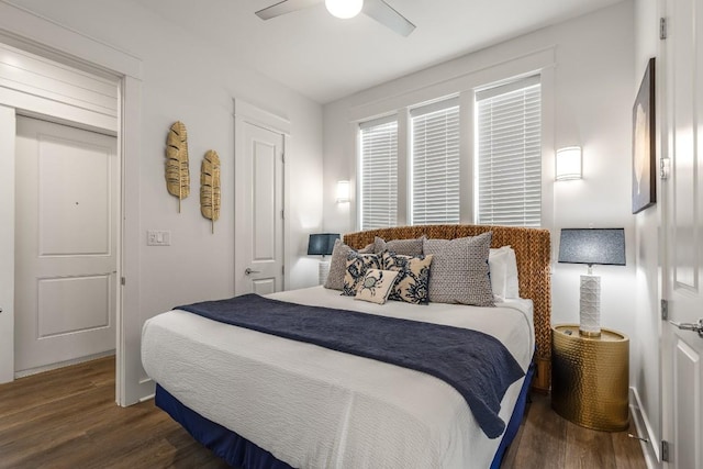 214 Sunset Ave Unit 5, Port Aransas, TX 78373 - bedroom featuring wood finished floors, ceiling fan, and baseboards
