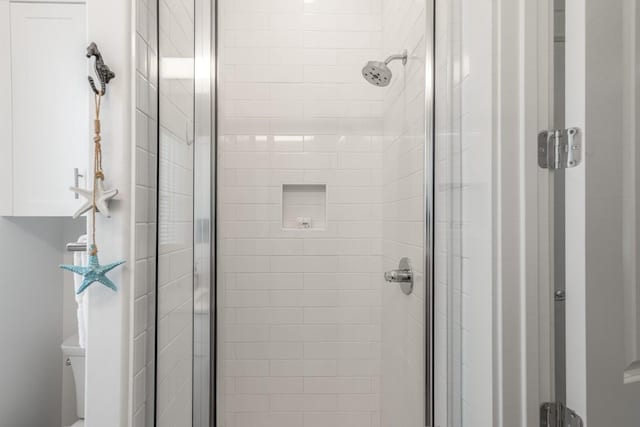 214 Sunset Ave Unit 5, Port Aransas, TX 78373 - bathroom with a shower stall and toilet