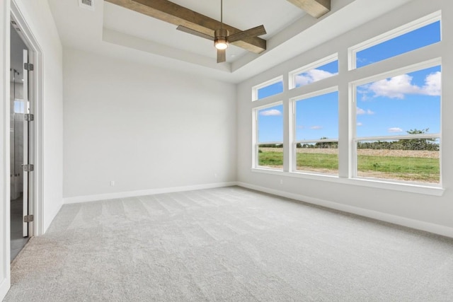 3236 Honeywood Dr, Leander, TX 78641 - empty room with carpet floors, ceiling fan, a raised ceiling, and beam ceiling