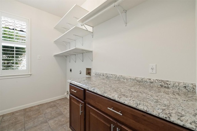 14408 Broadwinged Hawk Dr, Austin, TX 78738 - laundry room with hookup for an electric dryer, hookup for a washing machine, and baseboards