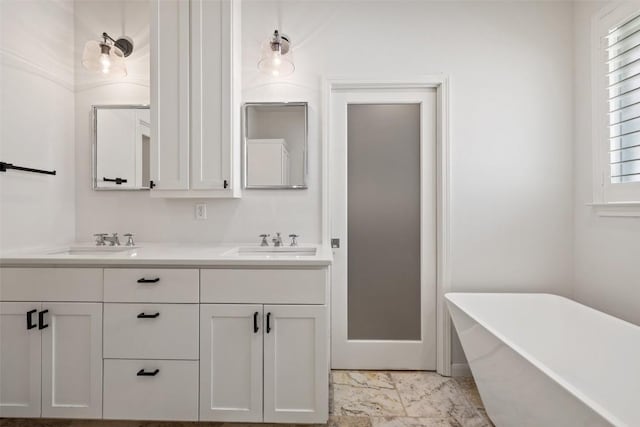 14408 Broadwinged Hawk Dr, Austin, TX 78738 - full bath featuring a freestanding tub, double vanity, and marble look tiles
