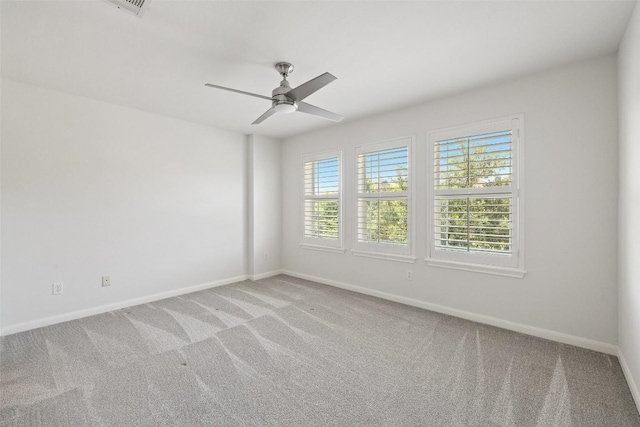 14408 Broadwinged Hawk Dr, Austin, TX 78738 - empty room with light colored carpet, baseboards, and ceiling fan