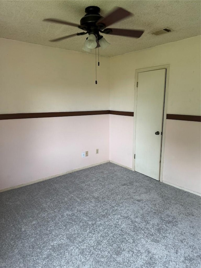 405 Lynch St, Smithville, TX 78957 - spare room featuring a ceiling fan, carpet flooring, and a textured ceiling