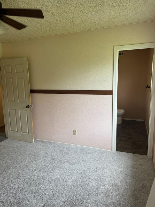 405 Lynch St, Smithville, TX 78957 - unfurnished bedroom featuring carpet flooring and ensuite bathroom