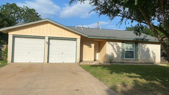 2006 Heathwood Cir, Round Rock, TX 78664 - single story home with brick siding, a garage, concrete driveway, and a front lawn