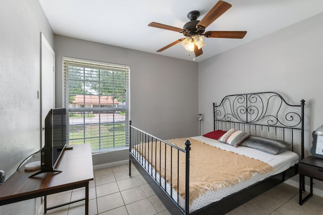 2006 Heathwood Cir, Round Rock, TX 78664 - bedroom featuring light tile patterned floors, multiple windows, and baseboards