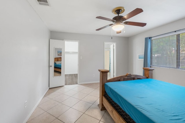 2006 Heathwood Cir, Round Rock, TX 78664 - bedroom with light tile patterned flooring, baseboards, and a ceiling fan