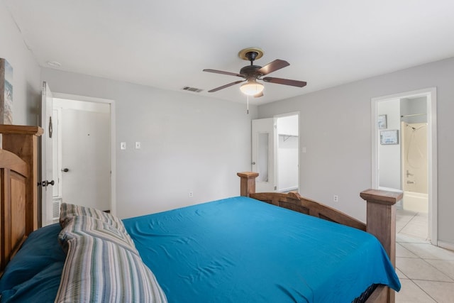 2006 Heathwood Cir, Round Rock, TX 78664 - bedroom featuring light tile patterned floors, a ceiling fan, and ensuite bathroom