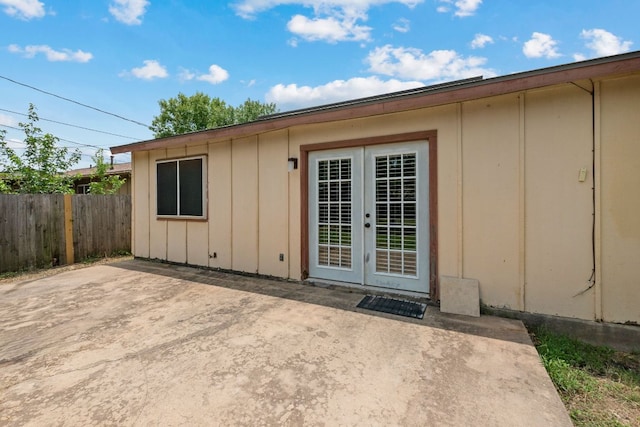 2006 Heathwood Cir, Round Rock, TX 78664 - entrance to property with a patio, board and batten siding, and french doors