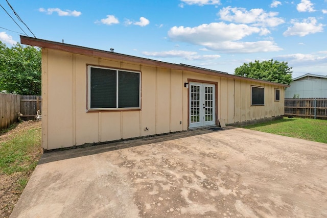 2006 Heathwood Cir, Round Rock, TX 78664 - rear view of property with french doors, a patio, and board and batten siding