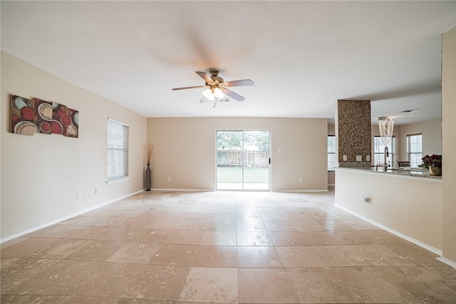 11228 Pickard Ln, Austin, TX 78748 - unfurnished room with ceiling fan, baseboards, and a sink