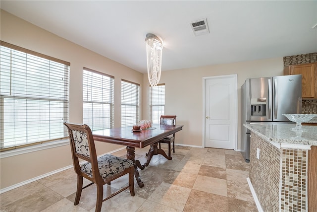 11228 Pickard Ln, Austin, TX 78748 - dining area featuring healthy amount of natural light and baseboards