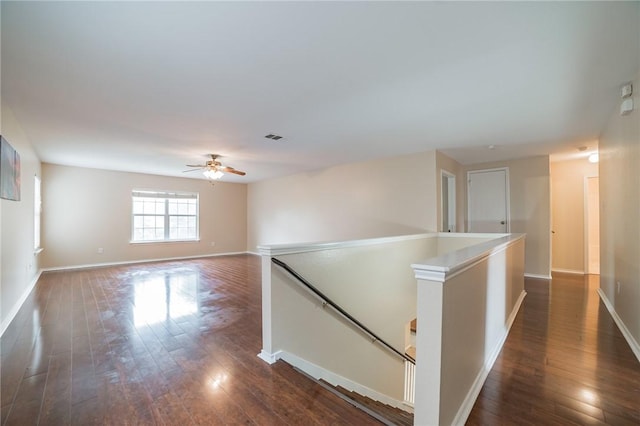 11228 Pickard Ln, Austin, TX 78748 - empty room featuring dark wood finished floors, ceiling fan, and baseboards