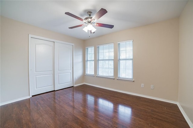 11228 Pickard Ln, Austin, TX 78748 - unfurnished bedroom with baseboards, a closet, dark wood-type flooring, and ceiling fan