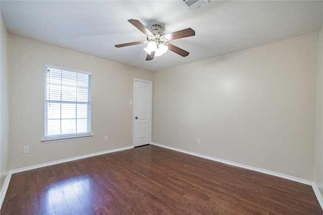 11228 Pickard Ln, Austin, TX 78748 - unfurnished room featuring dark wood-style floors, baseboards, and ceiling fan