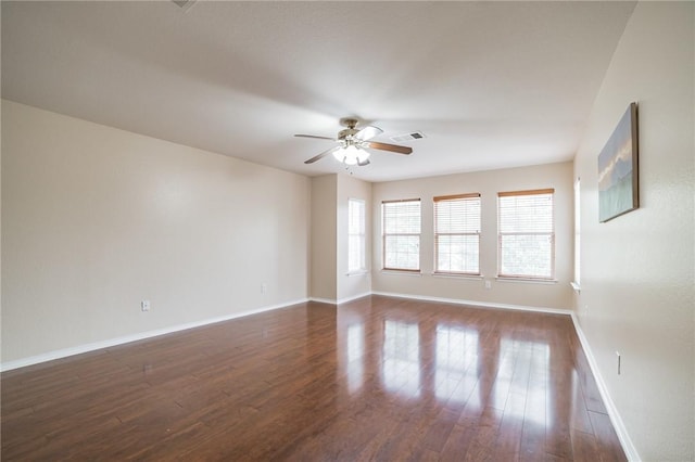 11228 Pickard Ln, Austin, TX 78748 - spare room with a ceiling fan, dark wood finished floors, and baseboards