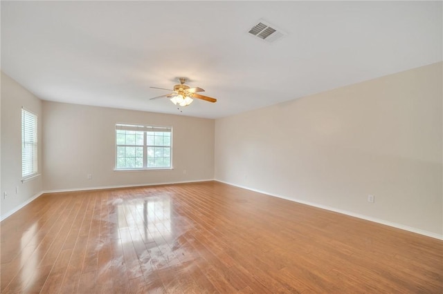 11228 Pickard Ln, Austin, TX 78748 - unfurnished room featuring light wood finished floors, baseboards, and ceiling fan