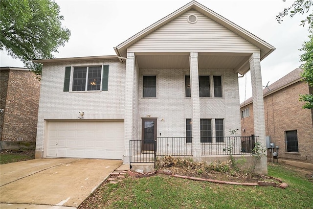 11228 Pickard Ln, Austin, TX 78748 - view of front of house with a garage, concrete driveway, and brick siding