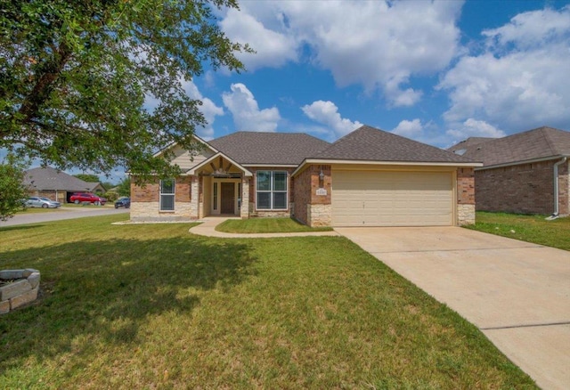 1220 Neuberry Cliffe, Temple, TX 76502 - view of front of home featuring an attached garage, a front yard, driveway, and stone siding
