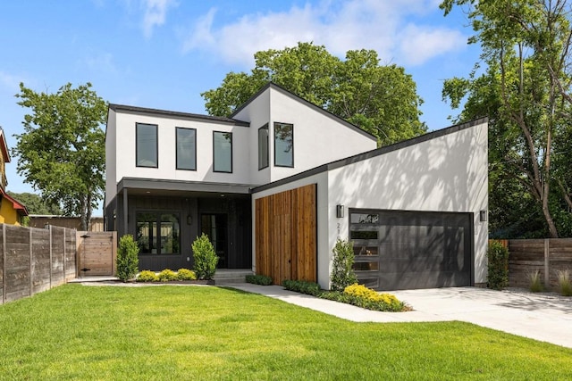 2106 Thornton Rd, Austin, TX 78704 - modern home featuring driveway, an attached garage, and stucco siding